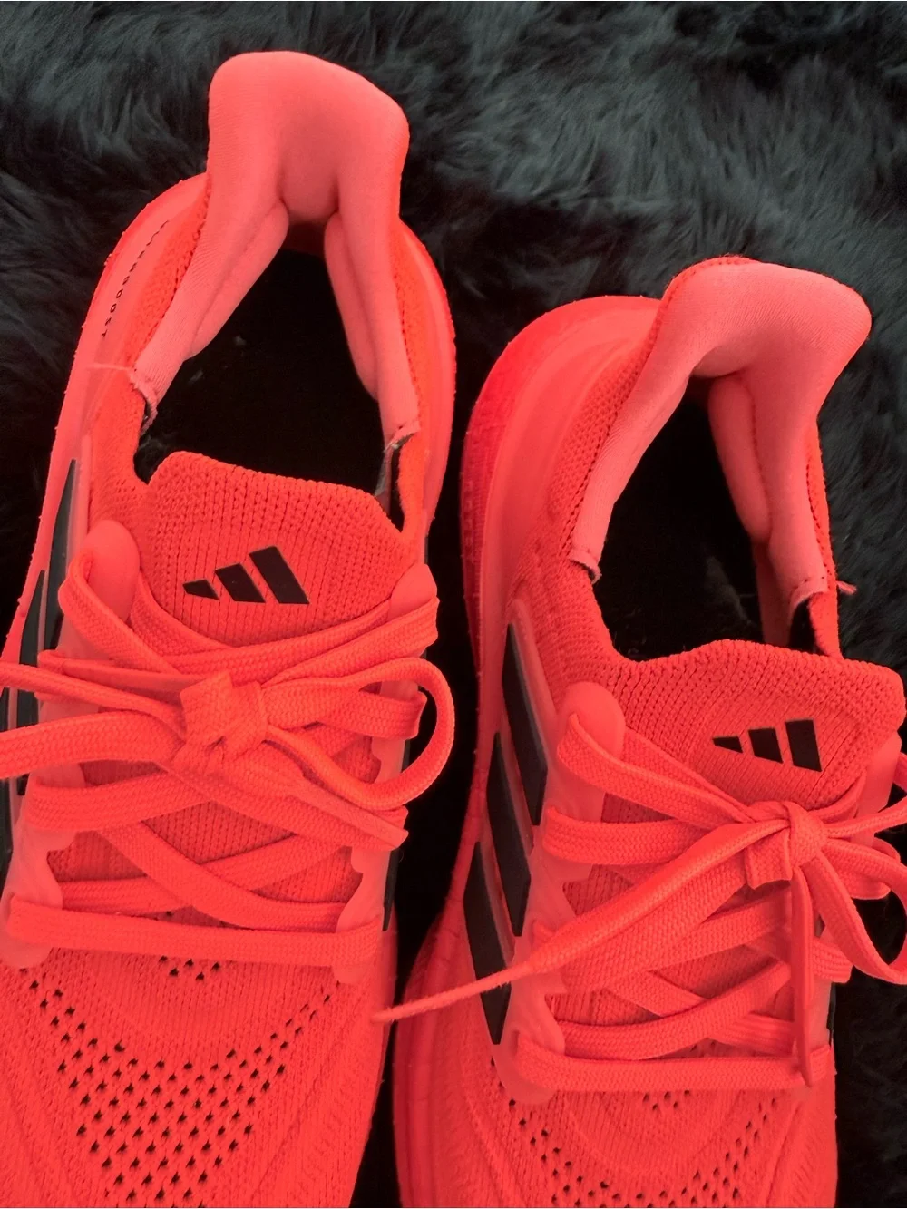 adidas red orange Ultraboost Running Sneakers.